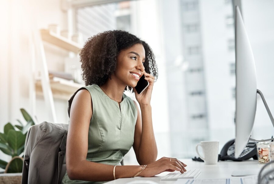 black-woman-phone-call-computer-office-as-creative-graphic-designer-ux-market-research-smile-project-female-person-cellphone-online-connection-website-proposal-network_590464-393629
